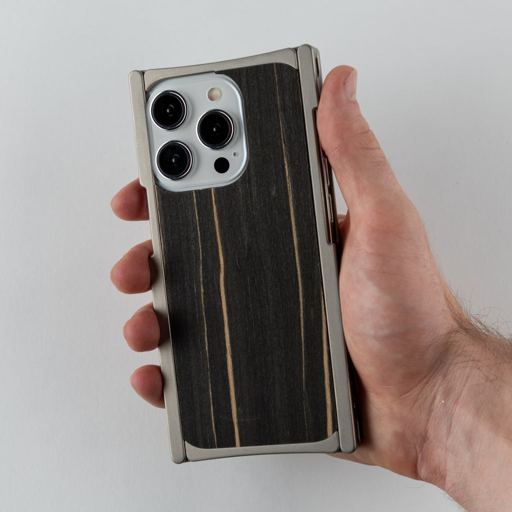 titanium and ebony iphone case in hand